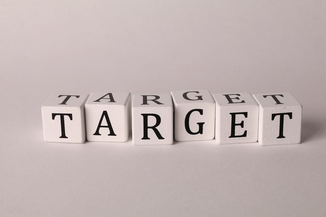 White cubes spelling TARGET on a neutral background, ideal for business or marketing concepts.